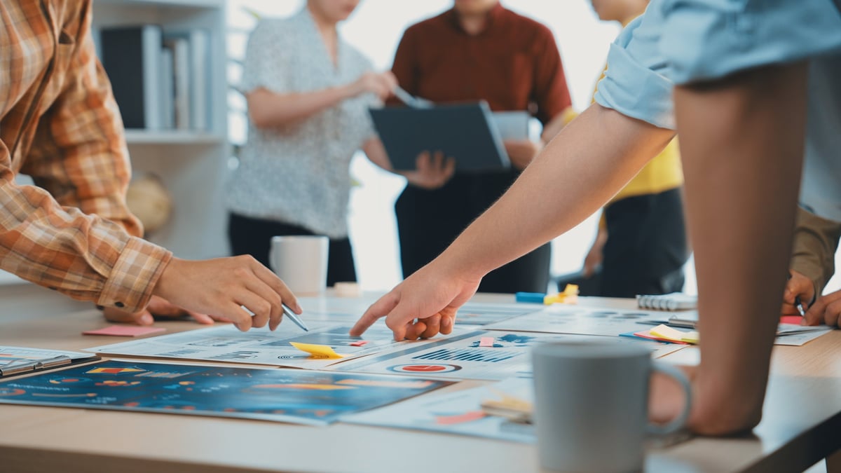 Team collaborating on marketing strategy in a modern office